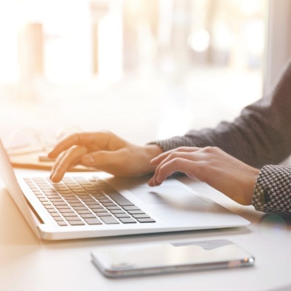 Closeup of woman typing